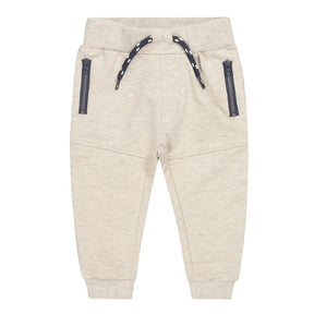 Light beige melange Dirkje boys joggers with dark blue zip pockets, front view