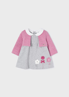 Front view of grey baby dress with pink cardigan and flower appliqués