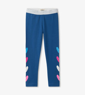 Hatley girls blue leggings with silver waistband and pink turquoise white hearts, front view