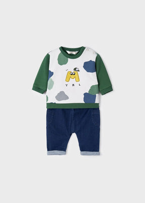Front view of green graphic sweatshirt and dark blue baby pants set