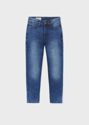 Medium blue slim-fit boys denim pants, front view