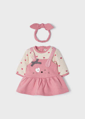 Pink bunny pinafore-style baby dress with matching bow headband