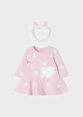 Front view of pink cat-print baby dress with matching headband