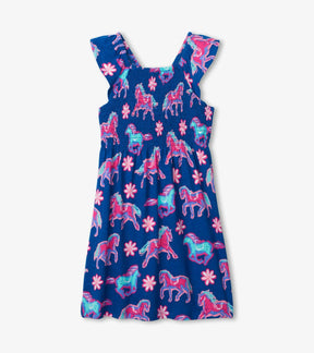 Front view of Hatley Electric Horses smocked dress in navy with pink and turquoise horses