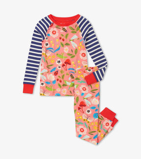 Front view of Hatley Enchanted Garden pajamas with coral garden print, navy striped raglan sleeves and red cuffs.