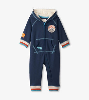 Front of Hatley indigo baby hooded romper with zipper, front pocket and striped cuffs
