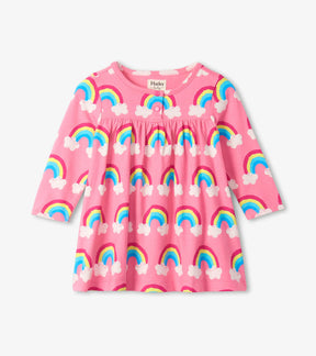 Hatley pink baby girls dress with blue yellow and white rainbow print, front view