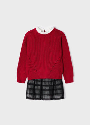 Front view of red sweater layered over black tulle girls dress