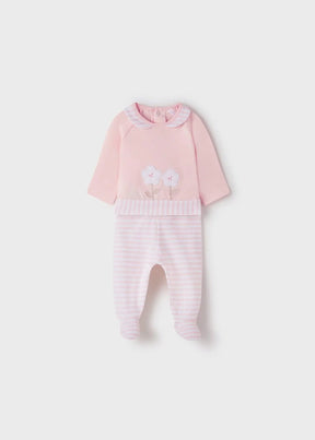 Pink newborn girl top and striped footed leggings, front view