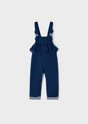 Front view of navy Mayoral baby girl dungarees with ruffle bib and bow straps