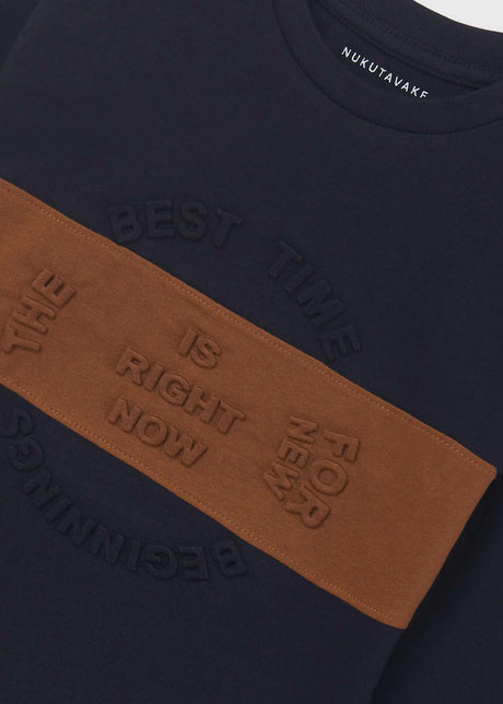 Closeup of Mayoral boys embossed graphic T-shirt showing Navy fabric and brown front detail.