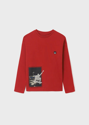 Front view of red boys long-sleeve T-shirt with skater graphic