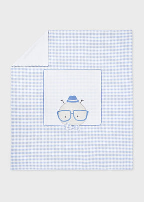 Blue gingham baby blanket with glasses character appliqué