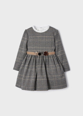 Front view of grey plaid girls dress with taupe flower belt