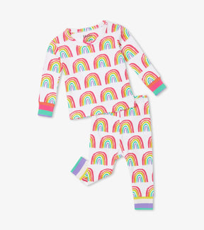 Front view of Hatley Pretty Rainbows baby pajama set in white with colorful rainbow print and striped cuffs.