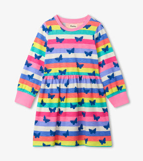 Hatley girls long-sleeve skater dress with rainbow stripes and navy butterfly print, front view