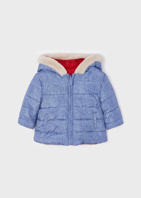 Front view of blue quilted reversible baby jacket with faux-fur hood trim