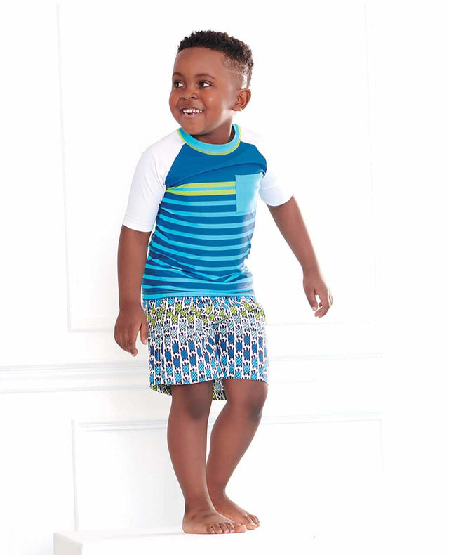 Hatley Sea Stripes short sleeve rashguard for boys in blue and white stripes worn with matching trunks