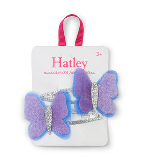 Two Hatley purple and blue butterfly hair clips with silver glitter bodies and snap clips on a display card.