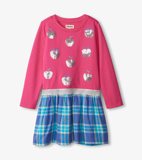 Front of Hatley Shiny Apple dress with pink long-sleeve top, silver apple details and blue plaid skirt
