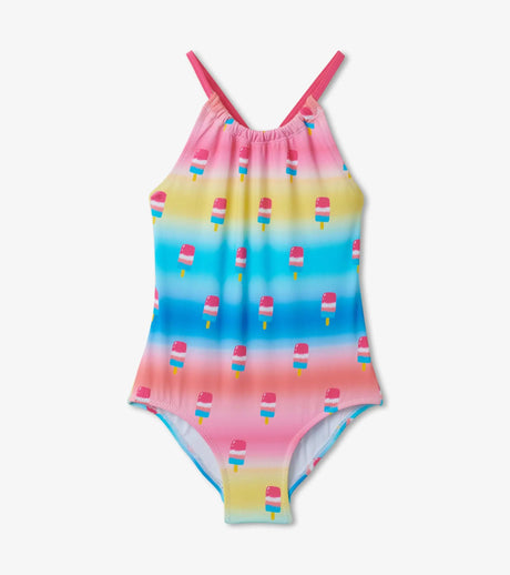 Flat lay front view of Hatley Sweet Treats multicolor kids swimsuit with cross straps and ruched neckline