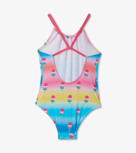 Back view of Sweet Treats multicolor kids swimsuit showing crossed straps and flamingo-and-treats print