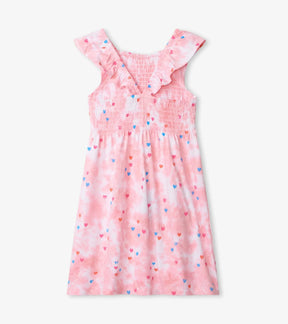 Back view of Hatley pink Tie Dye Hearts dress with ruffled V-back and smocking