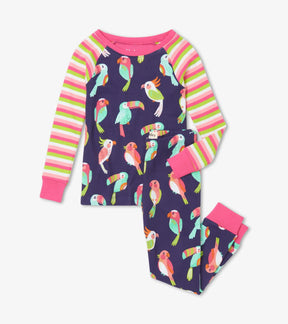 Hatley Tropical Birds girls pajama set, front view with navy bird print, rainbow-striped sleeves and matching cuffed pants.