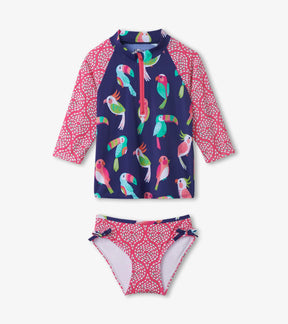 Front view of Hatley Tropical Birds rashguard set with pink sleeves and quarter zipper