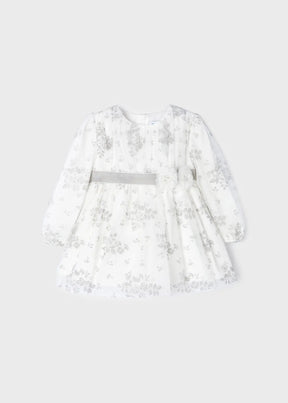 Front view of ivory baby tulle dress with grey floral print and bow