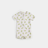 Kiwi print baby boy swim romper in crème and green on neutral background.