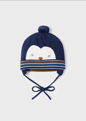 Flat lay of navy baby boys penguin bobble hat with earflaps