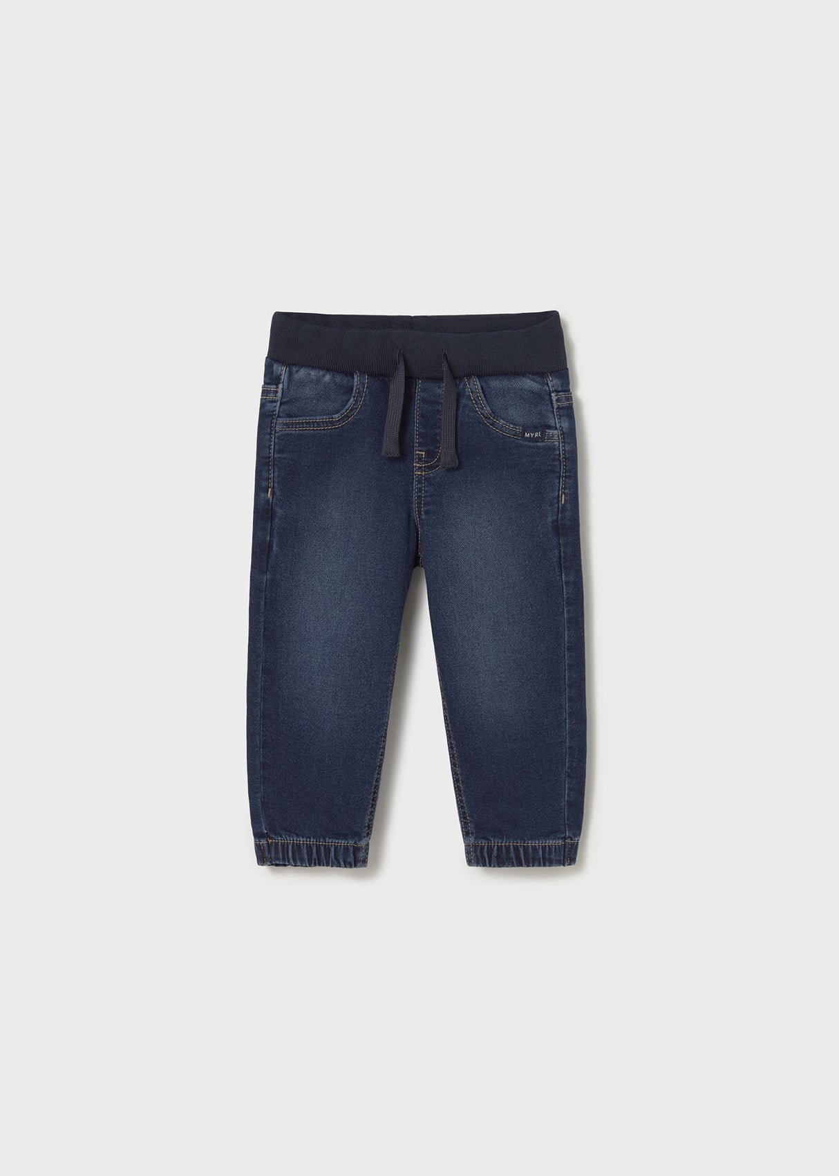 Front flat lay of dark denim jogger baby jeans showing tapered ankle.