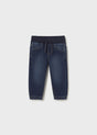 Front flat lay of dark denim jogger baby jeans showing tapered ankle.