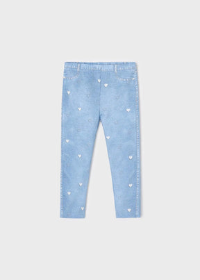 Light blue girls leggings with white heart print, front view