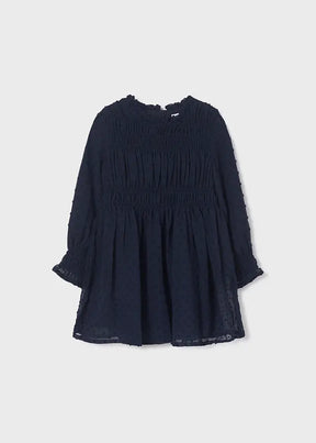Front view of girls navy plumeti chiffon dress with smocked bodice
