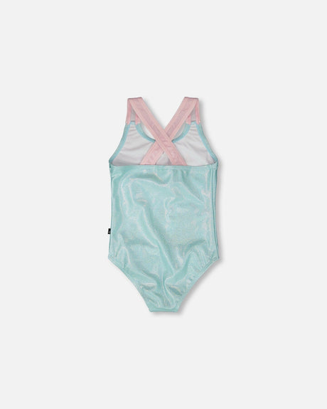 Back flat lay of aqua swimsuit showing pink crossed straps