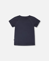 Back view of solid black short sleeve rashguard swim shirt for boys