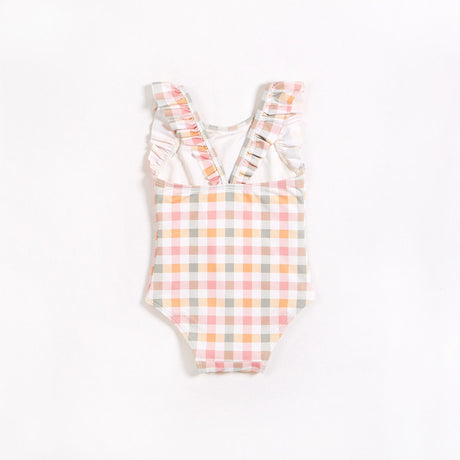 Front view of pastel gingham ruffle strap one-piece swimsuit for little girls on plain backdrop.