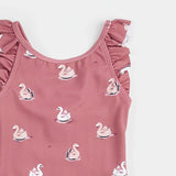Close-up of swan balloon print and ruffled shoulder detail on jazzberry Petit Lem kids swimsuit