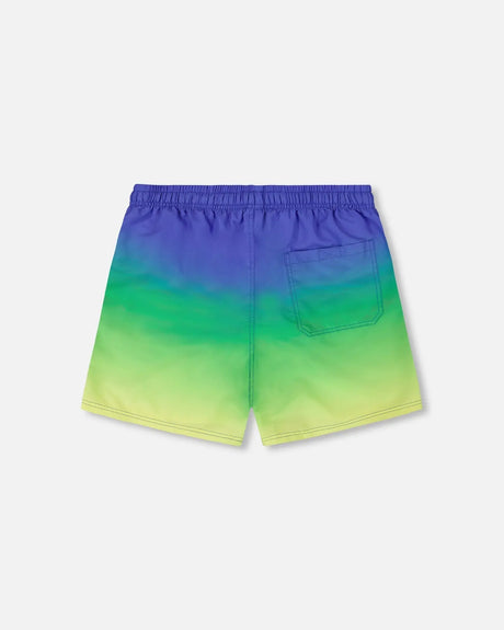 Back view of gradient swim trunks for boys in blue, green, and lime
