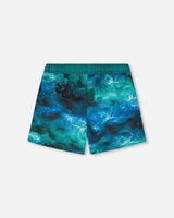 Back view of blue waves print swim trunks for boys