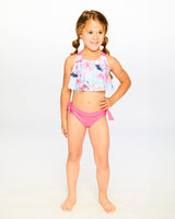 Studio front view of girl wearing blue flamingo two-piece swimsuit full body