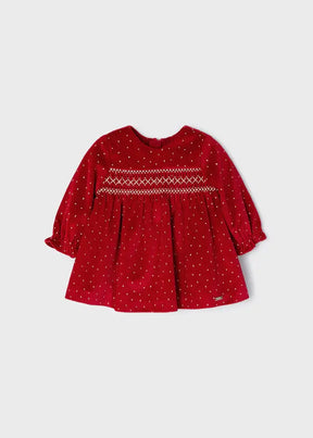 Front view of red Mayoral baby girl velvet dress with gold dots and smocked chest