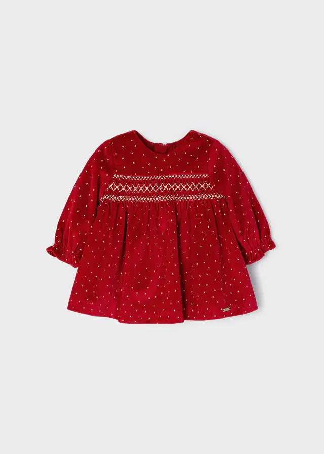 Front view of red Mayoral baby girl velvet dress with gold dots and smocked chest