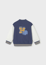 Back view of Mayoral baby boy bomber jacket with Navy body and contrast long sleeves.