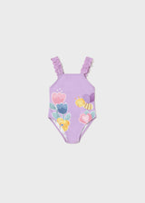 Mayoral baby girl Lilac graphic one-piece swimsuit with ruffled straps and colorful front print.
