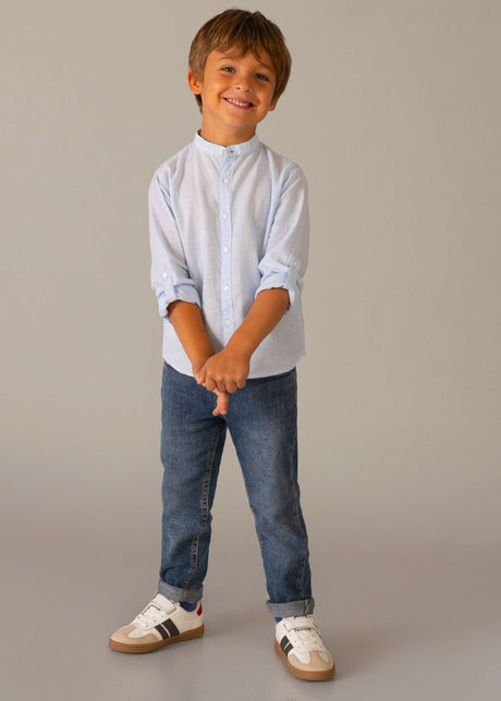 Boy standing in Mayoral Blue jeans showing regular fit and easy everyday styling.