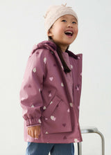 Close-up of girl wearing mauve heart-print raincoat