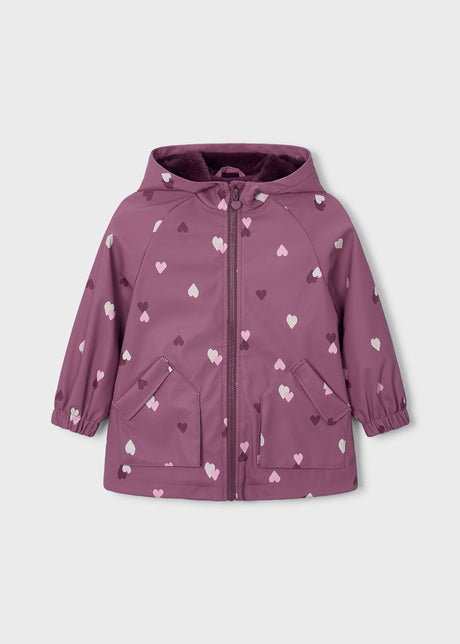 Front view of mauve girls hooded raincoat with heart print